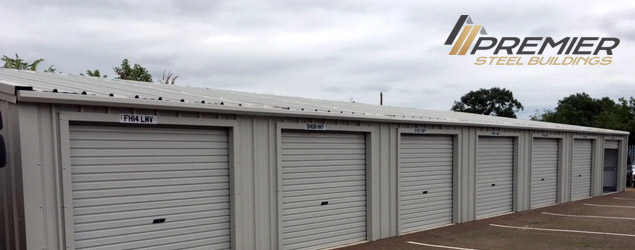 A long grey building with Premier Steel's logo in the top-right corner